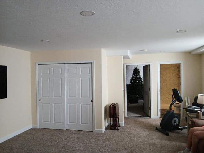 An unfinished basement room with bare walls