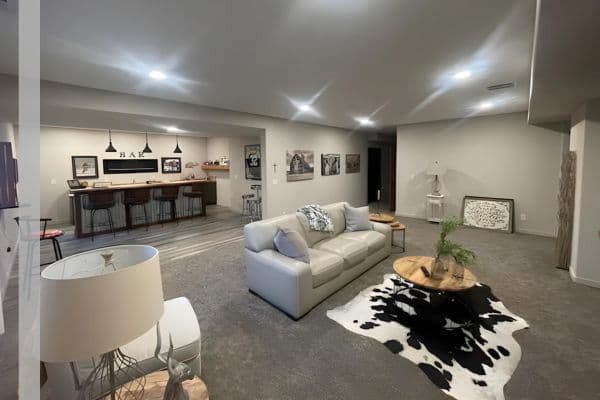 Finished basement with a bar and dining table
